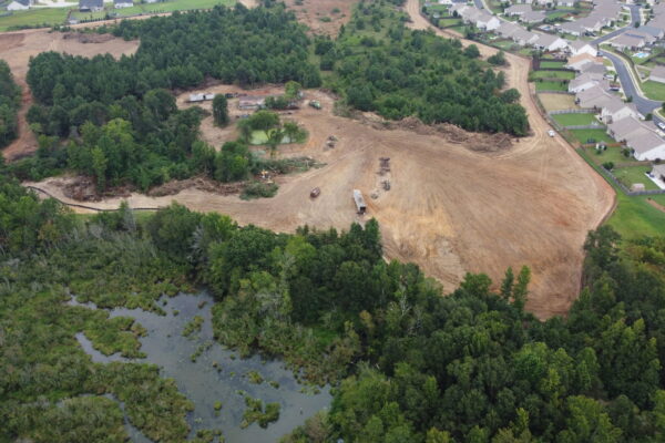 In-progress sitework at Lamb Farm residential community in Duncan, SC, with grading, utilities, and infrastructure preparation for 110 single-family homes by S3 Construction