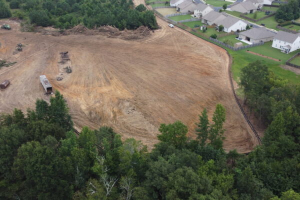 In-progress sitework at Lamb Farm residential community in Duncan, SC, with grading, utilities, and infrastructure preparation for 110 single-family homes by S3 Construction