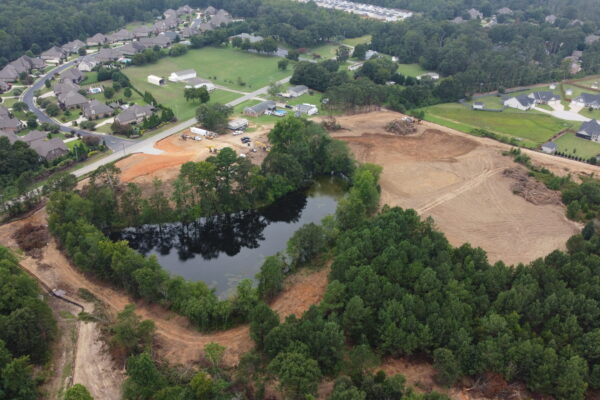 In-progress sitework at Lamb Farm residential community in Duncan, SC, with grading, utilities, and infrastructure preparation for 110 single-family homes by S3 Construction
