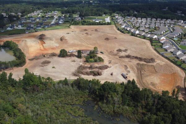 In-progress sitework at Lamb Farm residential community in Duncan, SC, with grading, utilities, and infrastructure preparation for 110 single-family homes by S3 Construction