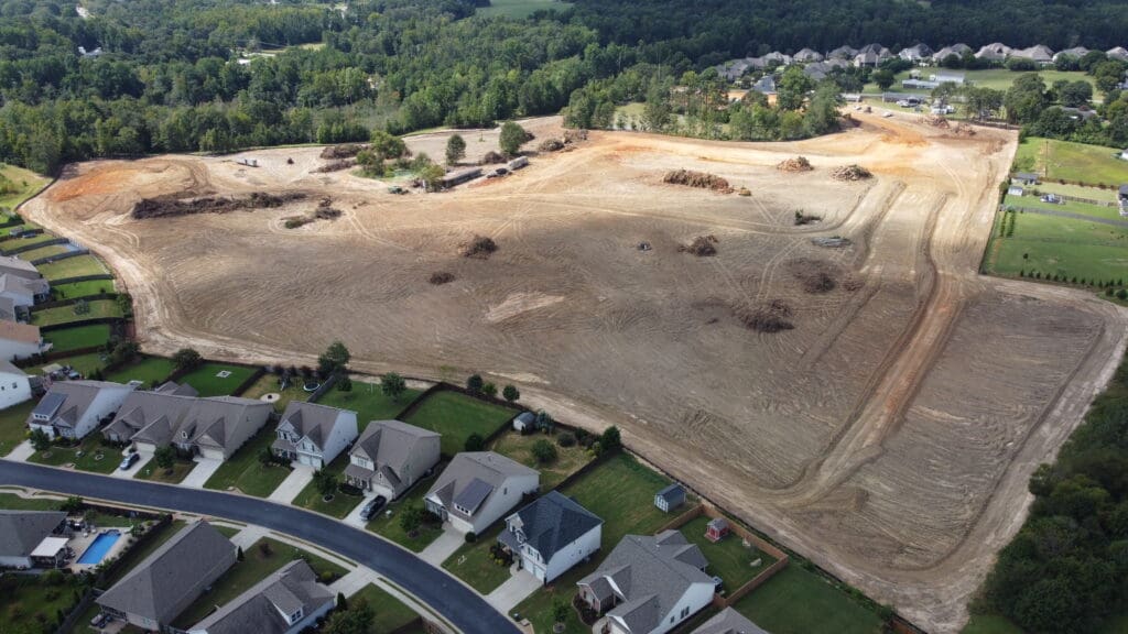 In-progress sitework at Lamb Farm residential community in Duncan, SC, with grading, utilities, and infrastructure preparation for 110 single-family homes by S3 Construction