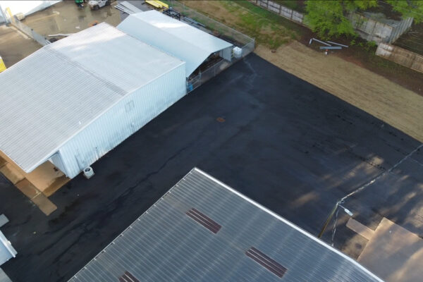 Aerial drone view of the completed Xytel Corporation industrial facility in Roebuck, SC, showcasing sitework including demolition, grading, utilities, stormwater systems, erosion control, and paving by S3 Construction