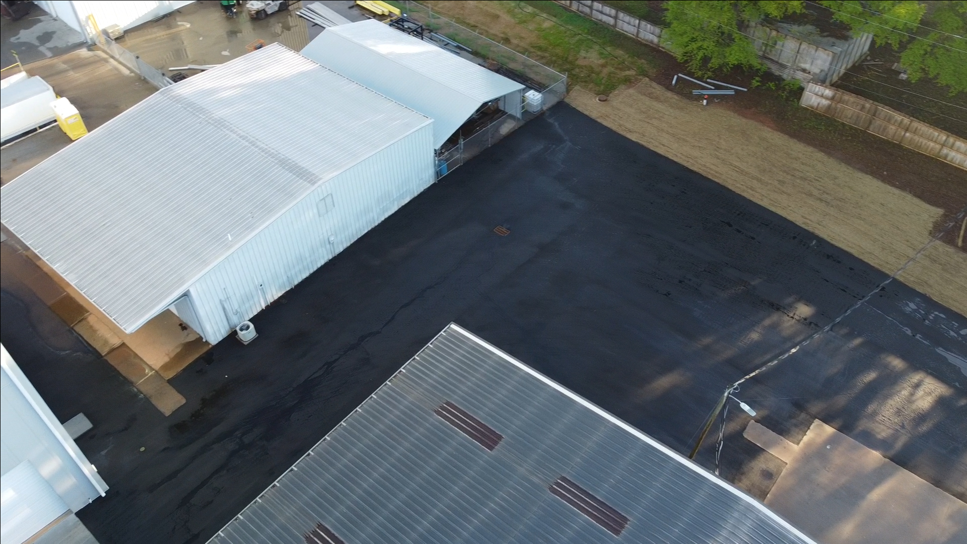 Aerial drone view of the completed Xytel Corporation industrial facility in Roebuck, SC, showcasing sitework including demolition, grading, utilities, stormwater systems, erosion control, and paving by S3 Construction