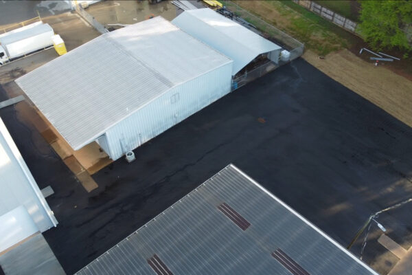 Aerial drone view of the completed Xytel Corporation industrial facility in Roebuck, SC, showcasing sitework including demolition, grading, utilities, stormwater systems, erosion control, and paving by S3 Construction