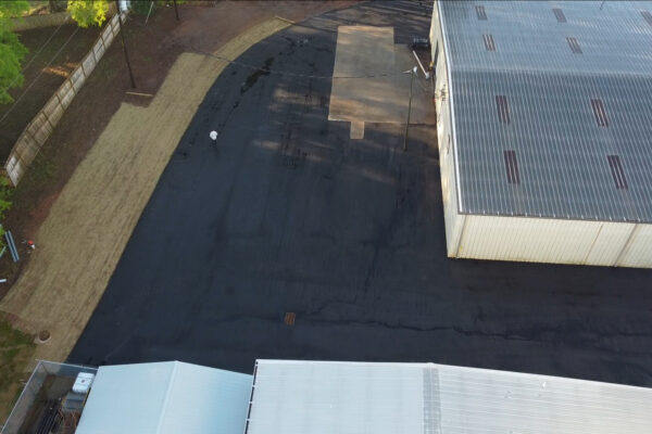 Aerial drone view of the completed Xytel Corporation industrial facility in Roebuck, SC, showcasing sitework including demolition, grading, utilities, stormwater systems, erosion control, and paving by S3 Construction
